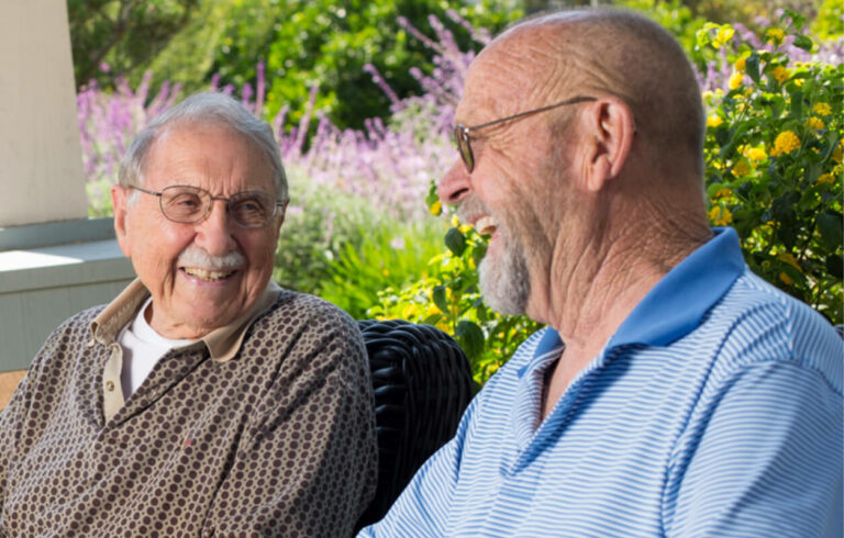 Hillcrest | Senior men talking and laughing