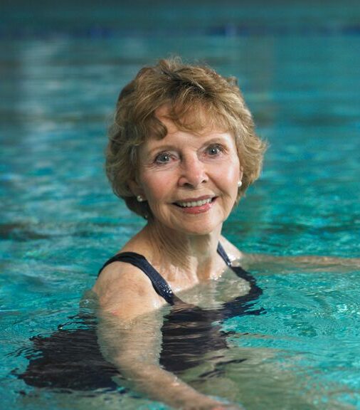 Hillcrest | Senior woman swimming in pool