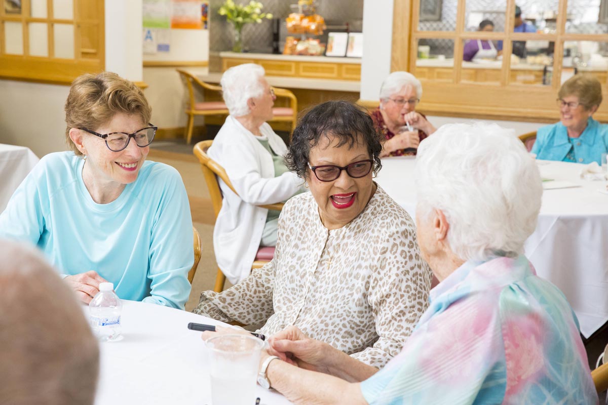 Hillcrest | Senior women socializing at lunch