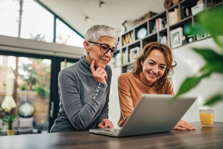 Hillcrest | Senior woman and daughter using laptop