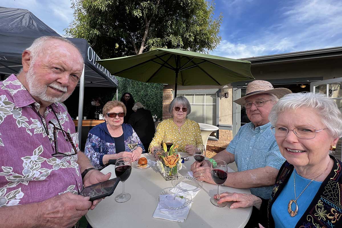 Hillcrest | Seniors drinking wine together