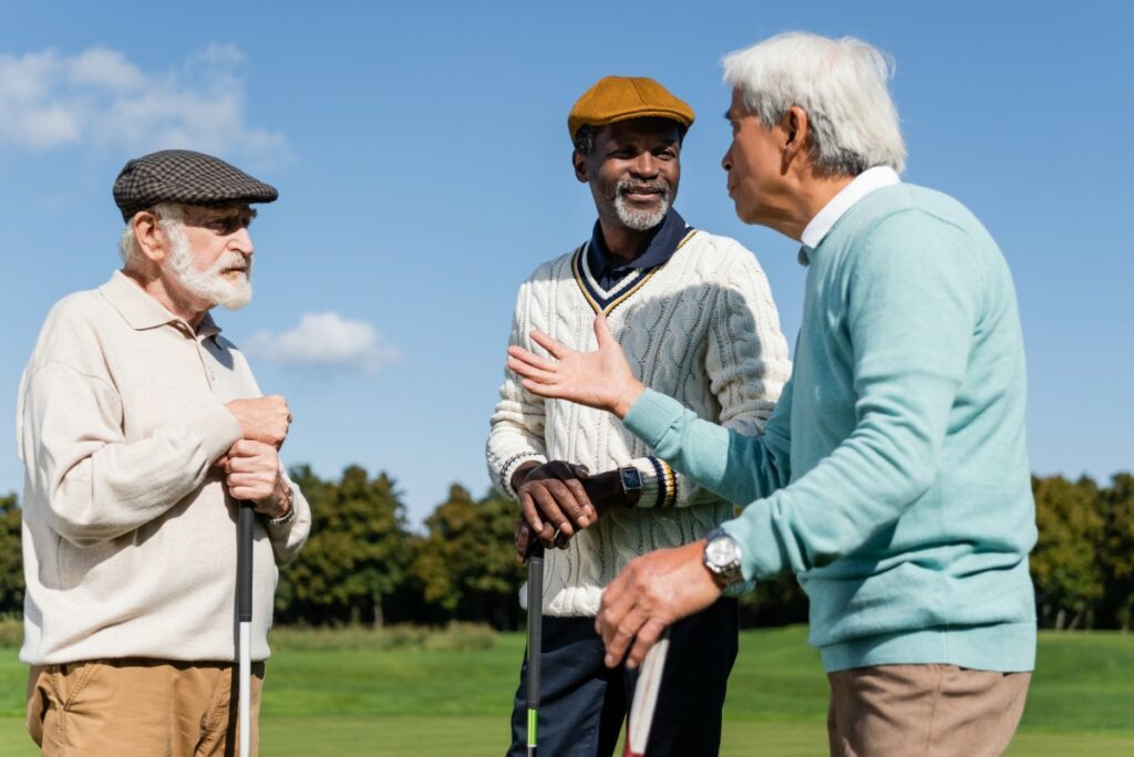 Hillcrest | Group of happy seniors playing golf