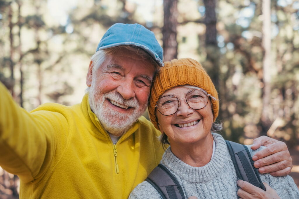 Hillcrest | Senior couple hiking and smiling for a photo