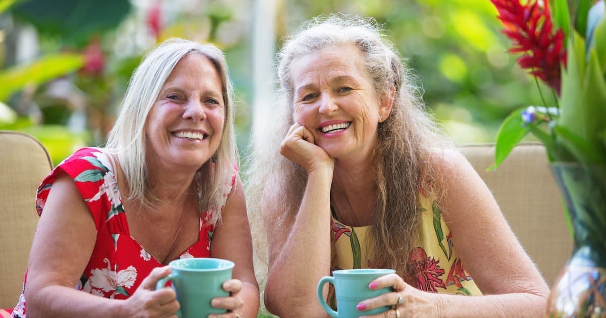 Hillcrest | Happy gay retired couple drinking coffee