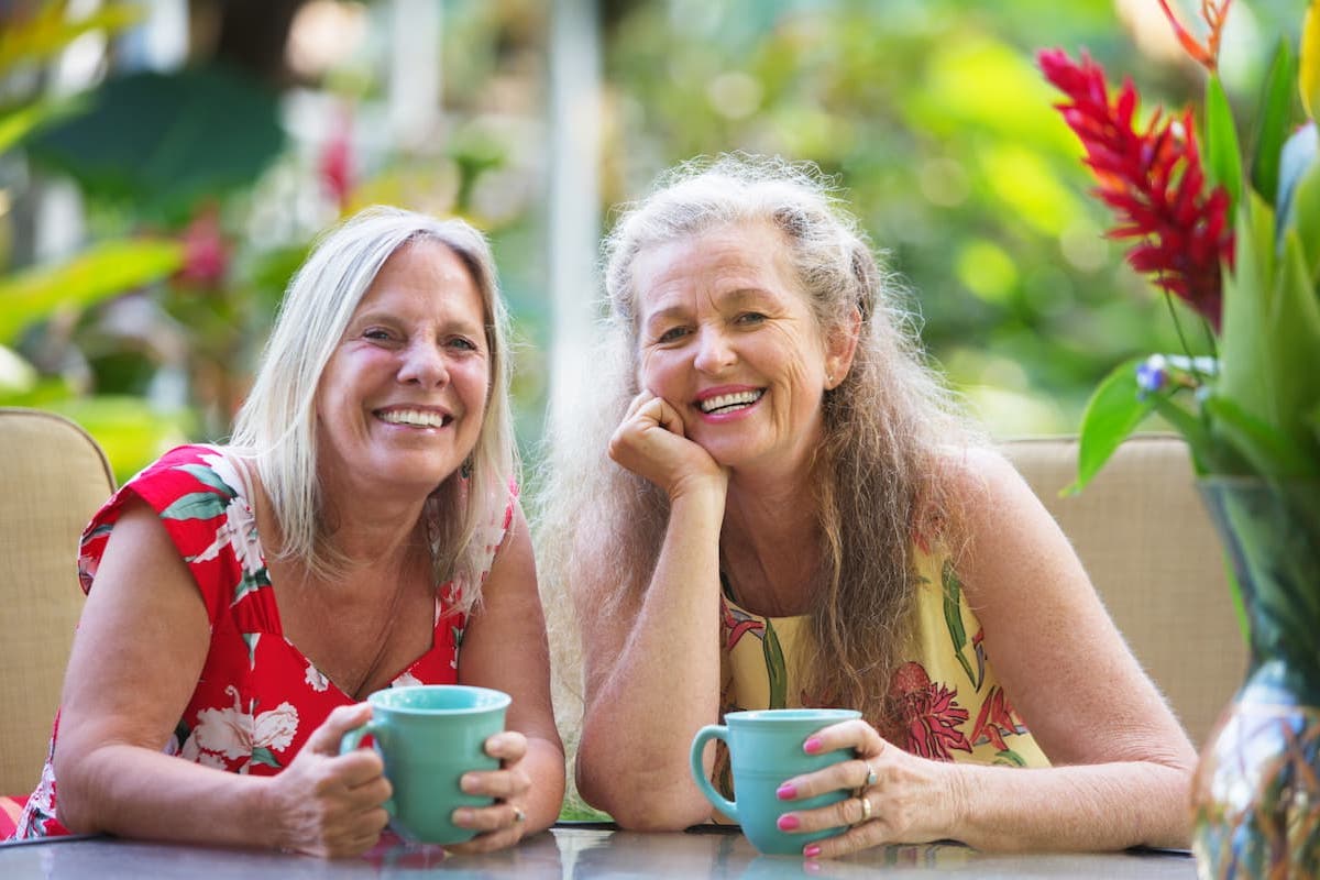 Hillcrest | Happy gay retired couple drinking coffee